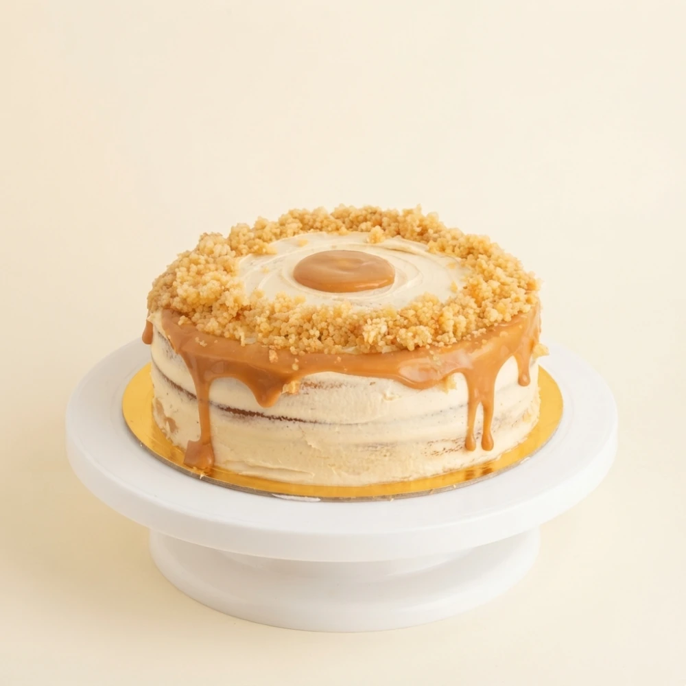 Torta artesanal Corazón de Arequipe con cobertura de manjar blanco y crumble, de Heartmade by Eliana en Barranquilla